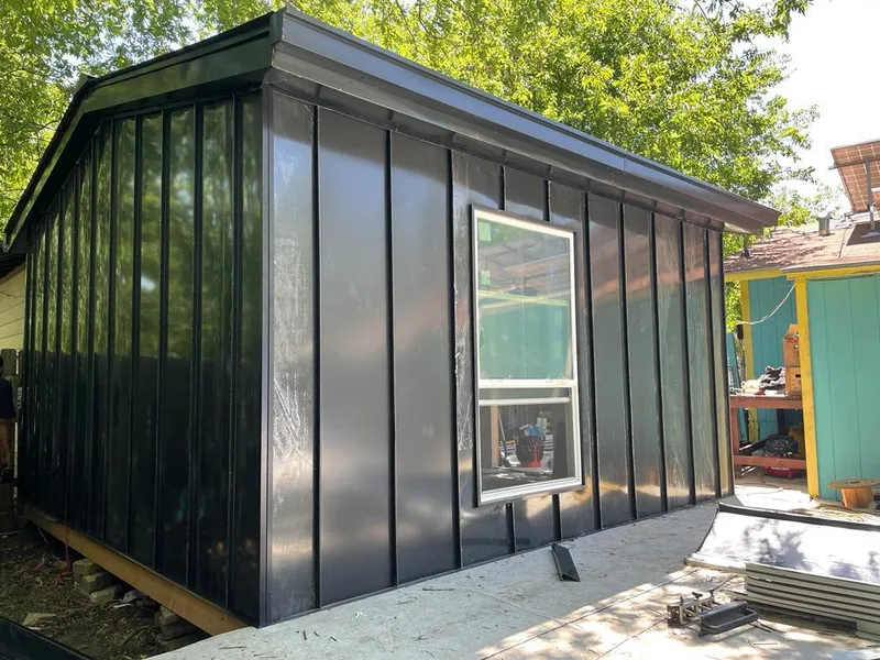 Black standing seam metal wall panels for Metal Roof Installation in North Kensington