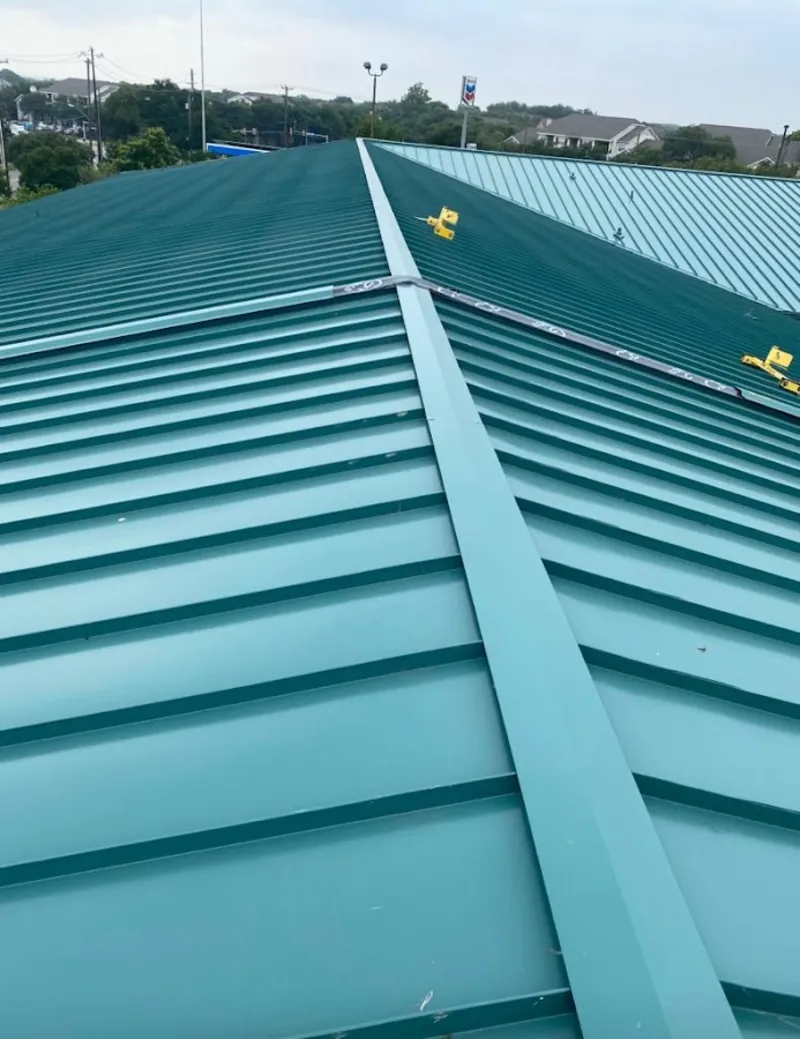 Green commercial metal roof ridge and valley for Metal Roof Repair in North Kensington